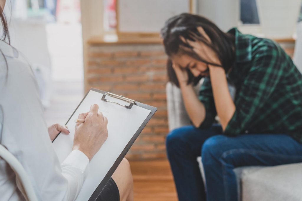 Therapist trying to help depressed patient